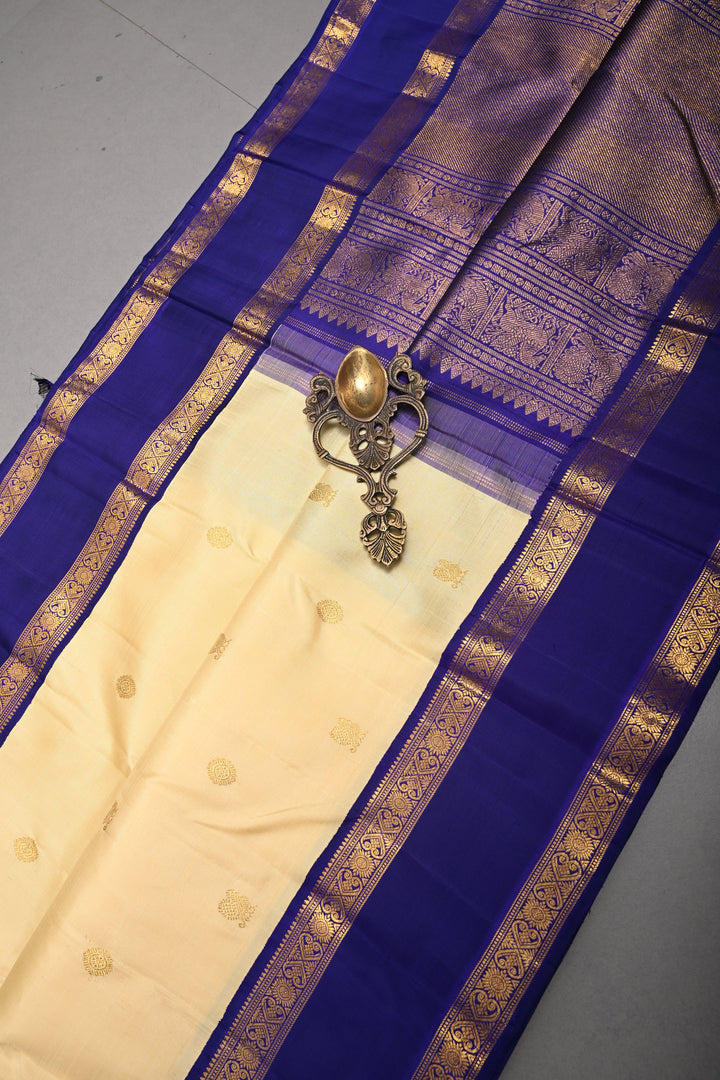 Cream Korvai Kanjivaram Pure Silk Saree with Zari Buttas and Contrast Zari Border | SILK MARK CERTIFIED | SHOBITAM