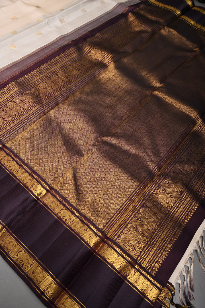 Cream Korvai Kanjivaram Pure Silk Saree with Zari Buttas and Contrast Zari Border | SILK MARK CERTIFIED | SHOBITAM