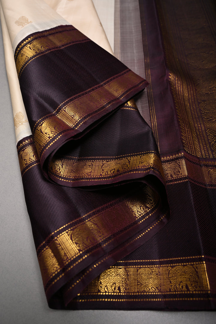 Cream Korvai Kanjivaram Pure Silk Saree with Zari Buttas and Contrast Zari Border | SILK MARK CERTIFIED | SHOBITAM