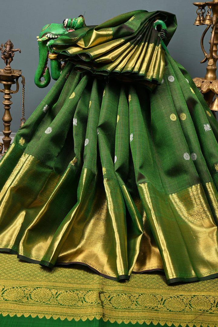 Deep Green Vairaoosi Zari Stripes on Pure Kanjivaram Silk Saree with Gold-Silver Zari Buttas and wide Zari Border | SILK MARK CERTIFIED | SHOBITAM
