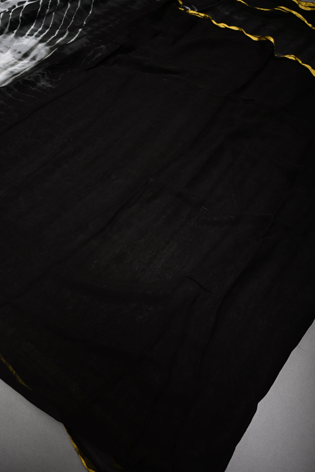 Black & White Shibori Tie-Dye Georgette Saree with Gold Zari Border  | SHOBITAM