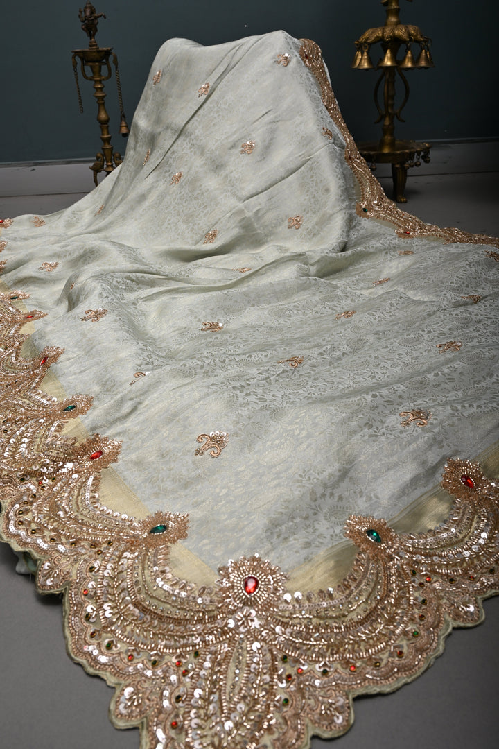 Light Sage Green Tissue Viscose Brocade Saree with Zardosi Buttas and Heavy Embroidery Work on Scallop Border | SHOBITAM