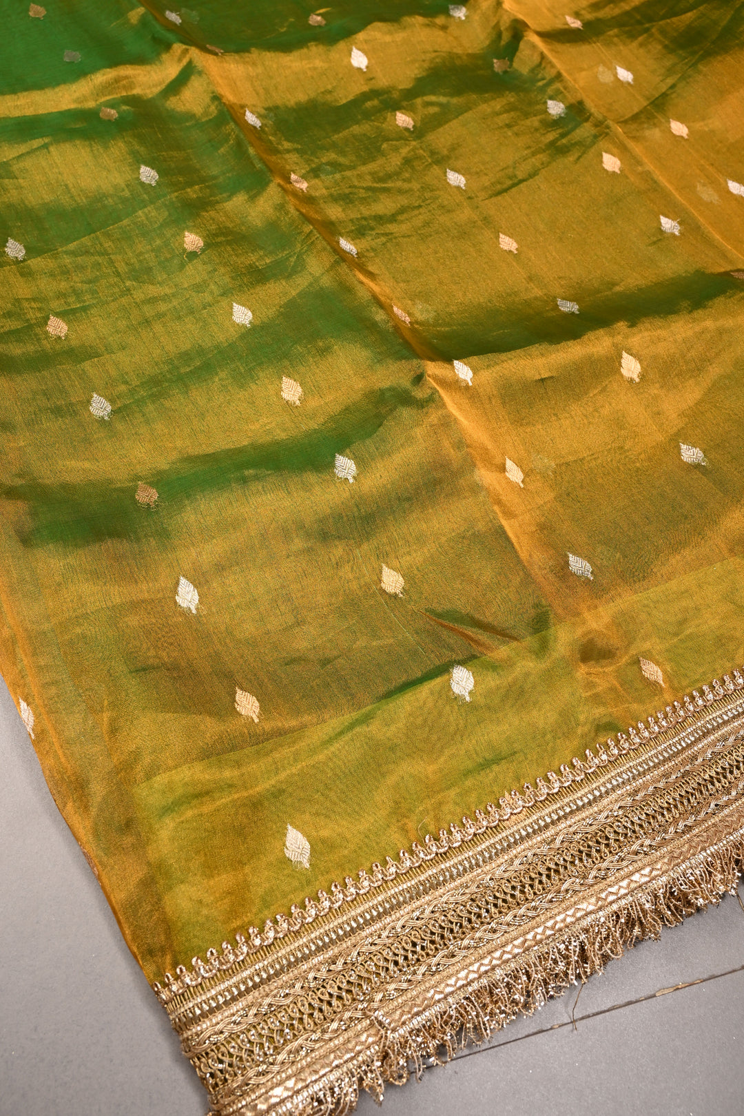 Mehendi Green Dual Tone Pure Banarasi Organza Tissue Silk Saree with Sona Rupa Floral Zari Buttas and Fancy Trim Lace Border | SILK MARK CERTIFIED | SHOBITAM