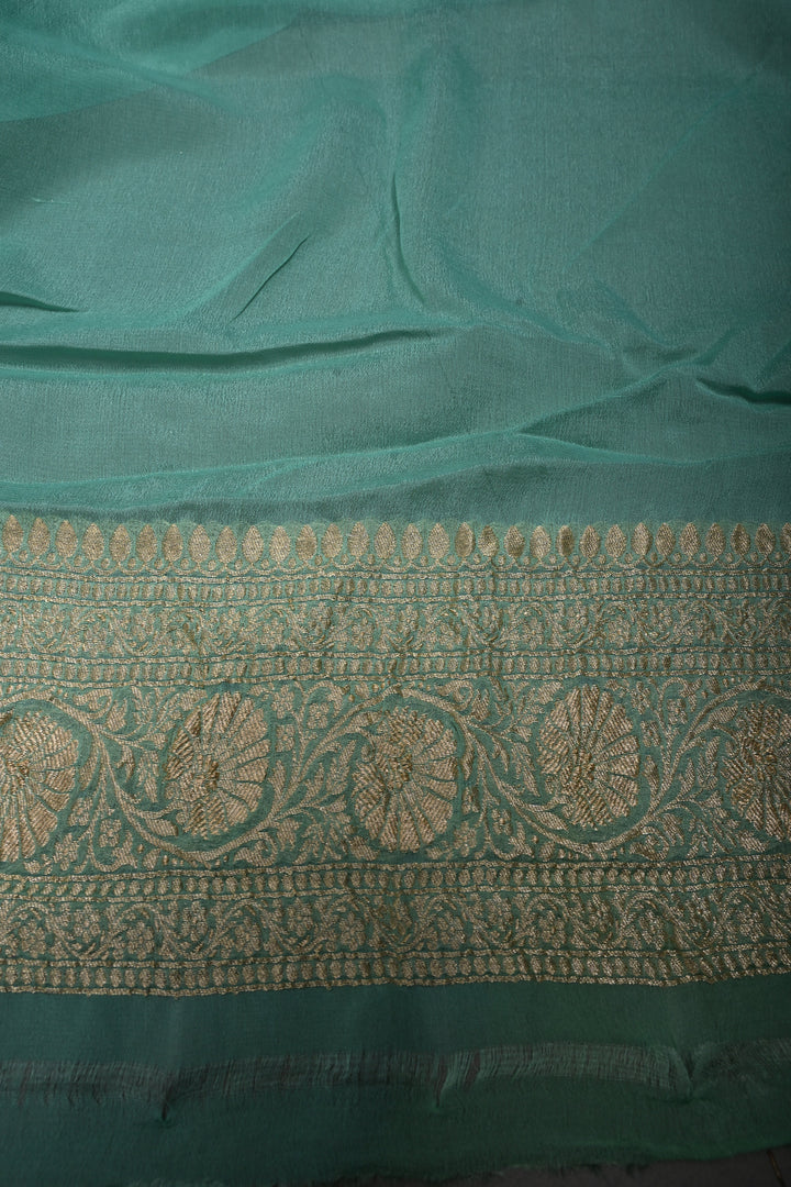Muted Ivory Banarasi Silk Georgette Saree with Zari Brocade and Teal Contrast Zari Border | SILK MARK CERTIFIED | SHOBITAM