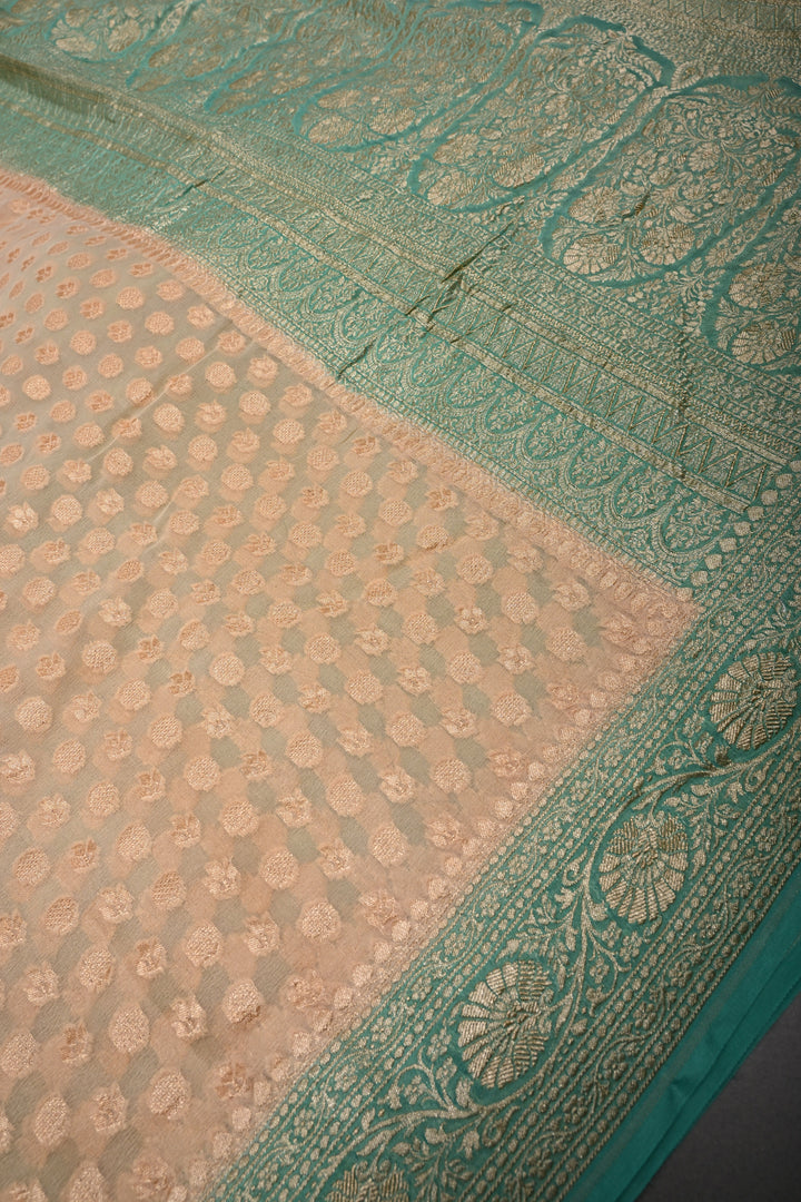 Muted Ivory Banarasi Silk Georgette Saree with Zari Brocade and Teal Contrast Zari Border | SILK MARK CERTIFIED | SHOBITAM