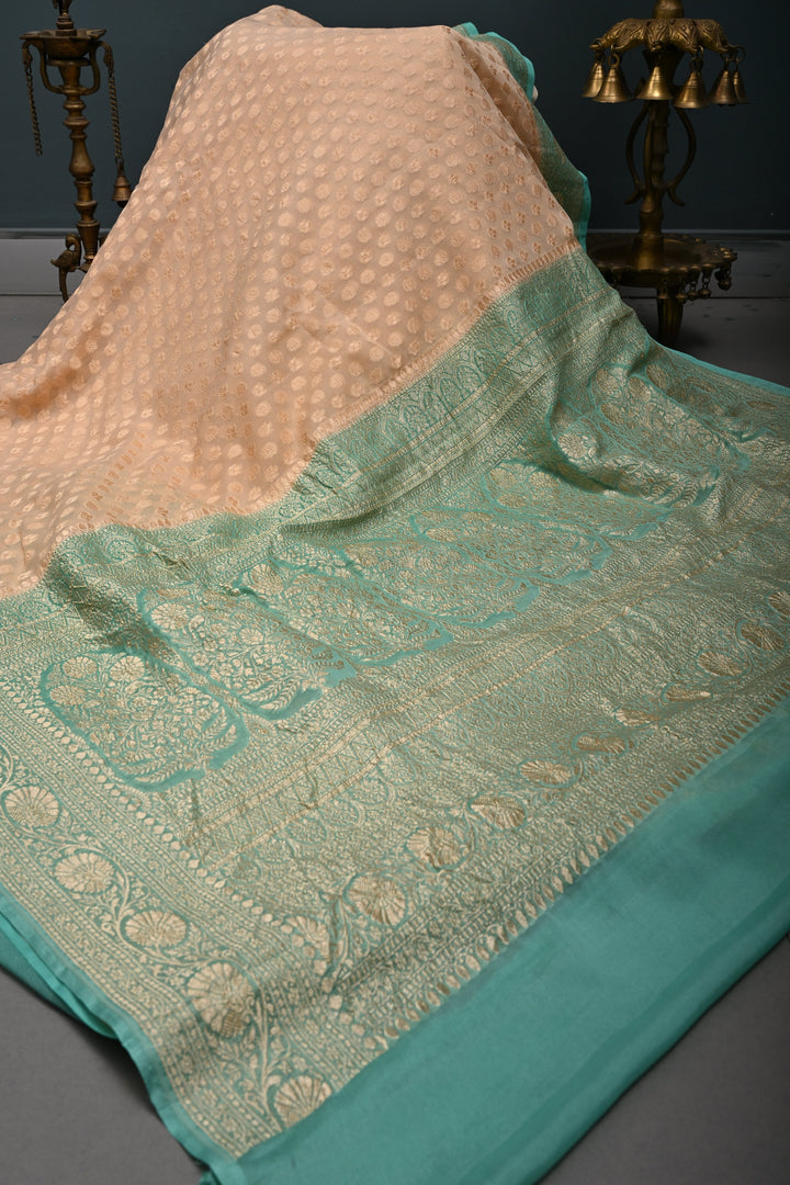 Muted Ivory Banarasi Silk Georgette Saree with Zari Brocade and Teal Contrast Zari Border | SILK MARK CERTIFIED | SHOBITAM