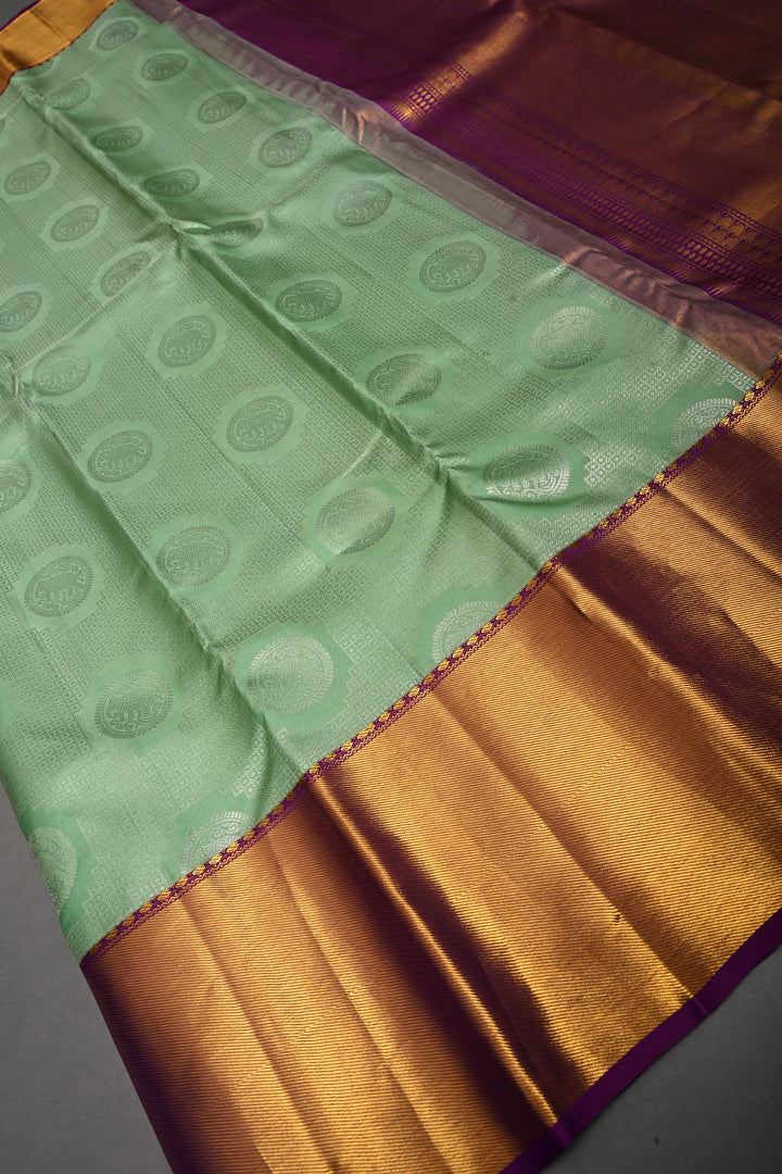 Mint Green Pure Kanjivaram Silk Saree with Silver Mandala Elephant Brocade and Contrast Zari Border | SILK MARK CERTIFIED | SHOBITAM