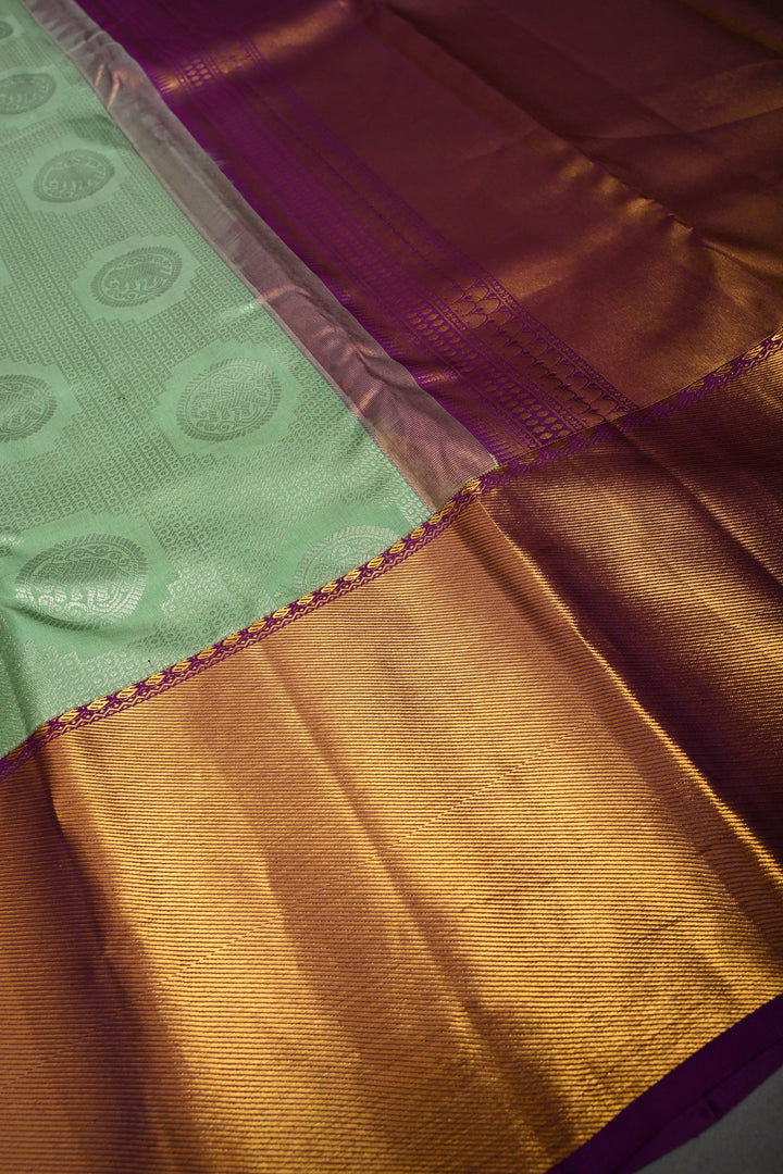 Mint Green Pure Kanjivaram Silk Saree with Silver Mandala Elephant Brocade and Contrast Zari Border | SILK MARK CERTIFIED | SHOBITAM