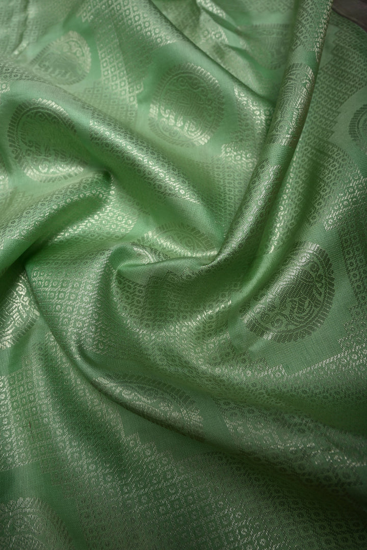 Mint Green Pure Kanjivaram Silk Saree with Silver Mandala Elephant Brocade and Contrast Zari Border | SILK MARK CERTIFIED | SHOBITAM
