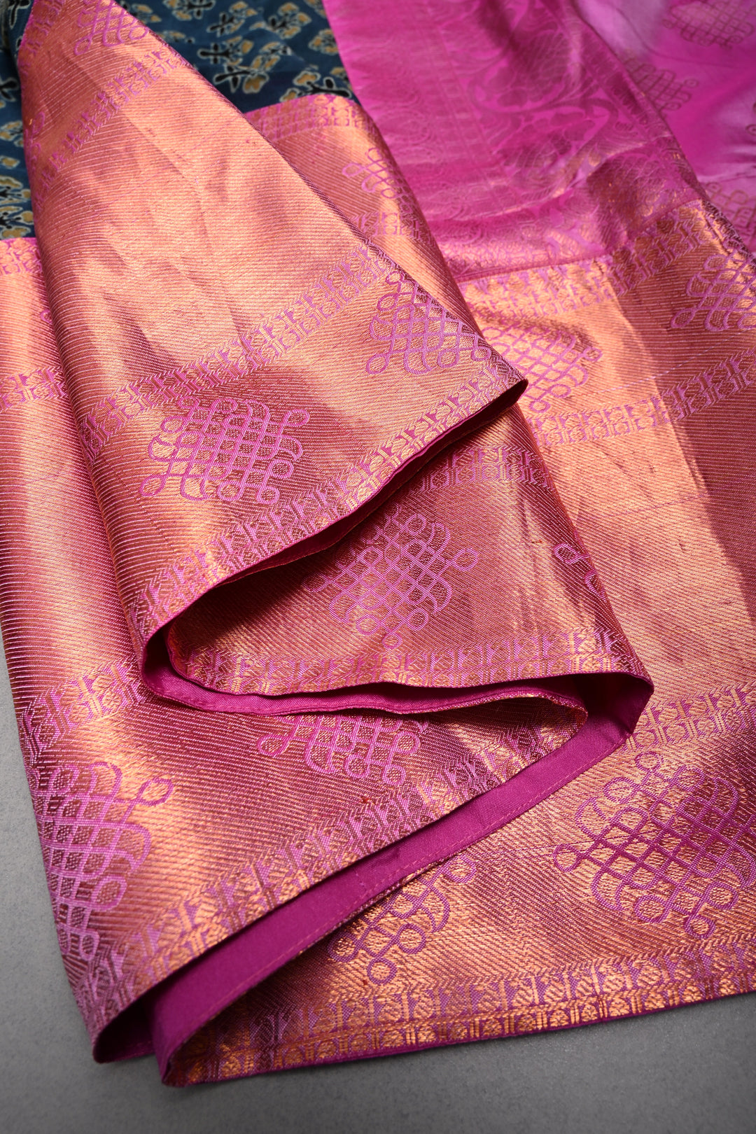 Exquisite Peacock Blue Georgette Ajrakh Hand Block Print Fusion Saree with Contrast Pure Silk Kanjivaram Rangoli Zari Border and Pallu | SHOBITAM