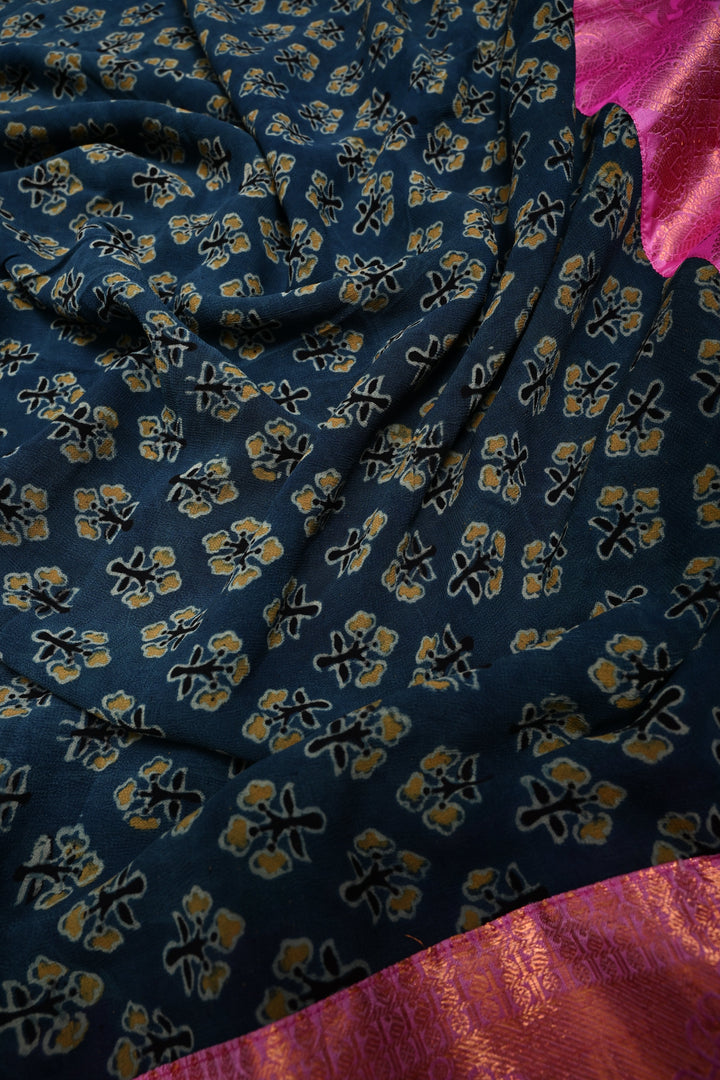 Exquisite Peacock Blue Georgette Ajrakh Hand Block Print Fusion Saree with Contrast Pure Silk Kanjivaram Rangoli Zari Border and Pallu | SHOBITAM