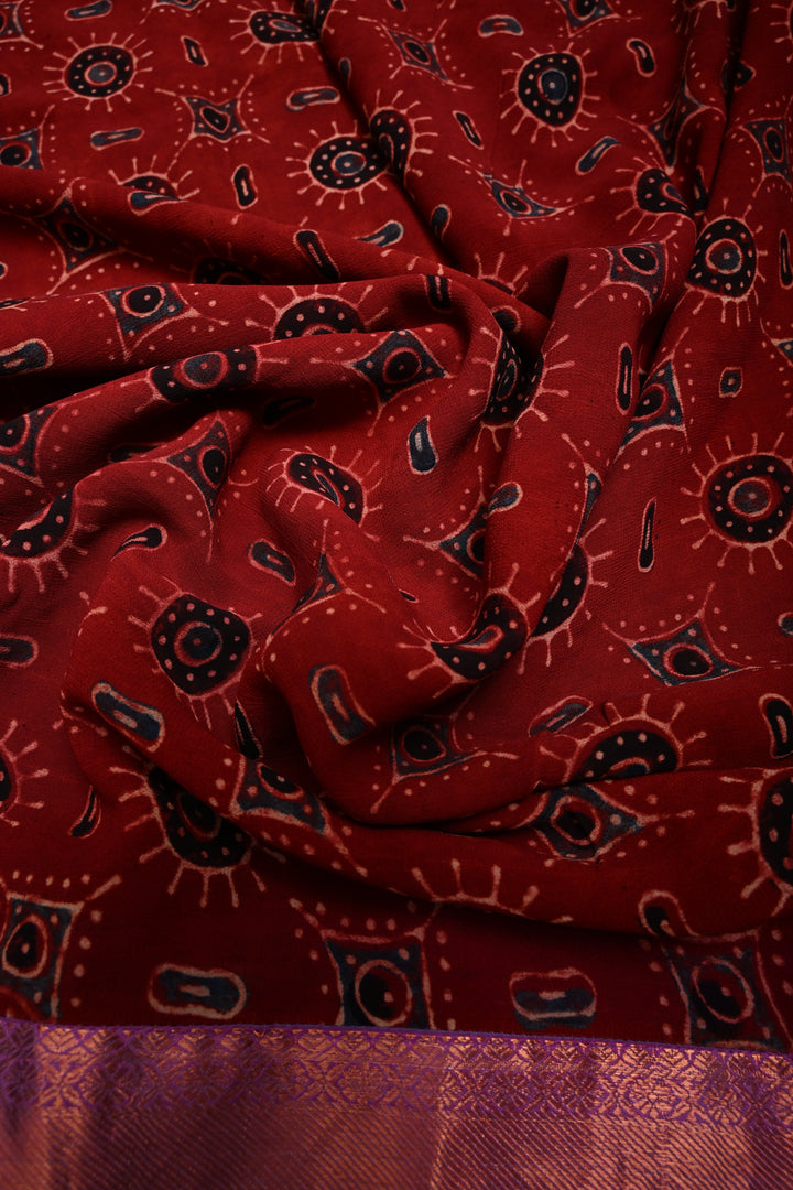 Brick Red Georgette Ajrakh Hand Block Print Fusion Saree with Contrast Pure Silk Kanchi Border and Pallu | SHOBITAM