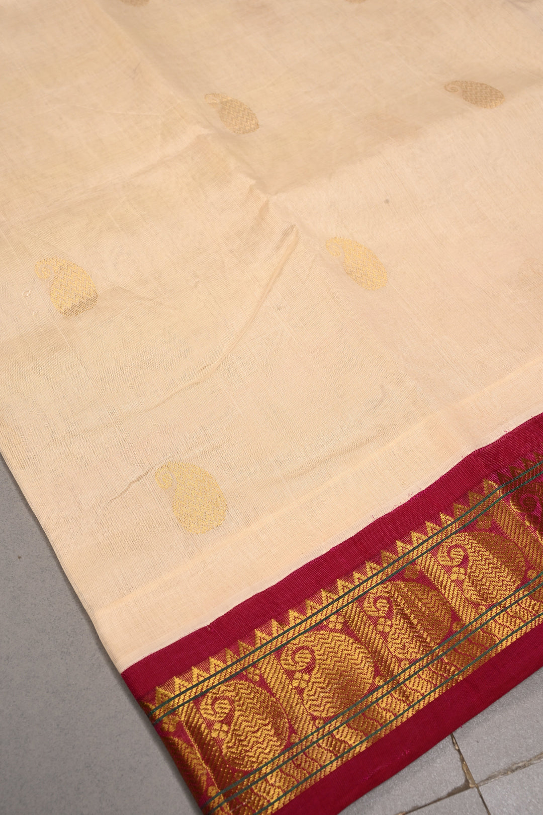 Off White Kanchi Silk Cotton Handloom Saree with Paisley Zari Buttas and Contrast Zari Border | SHOBITAM