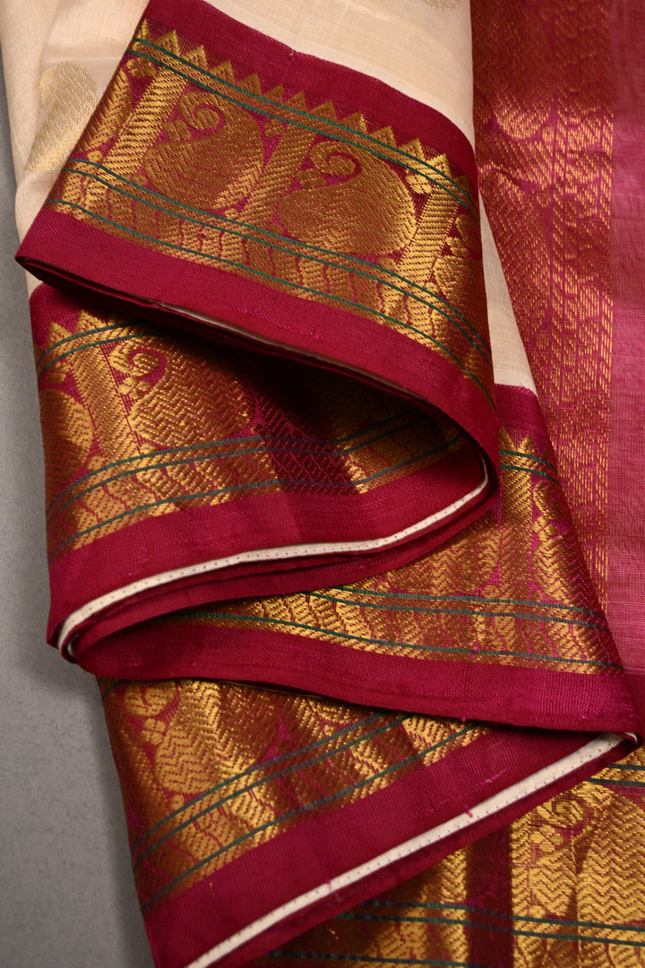 Off White Kanchi Silk Cotton Handloom Saree with Paisley Zari Buttas and Contrast Zari Border | SHOBITAM