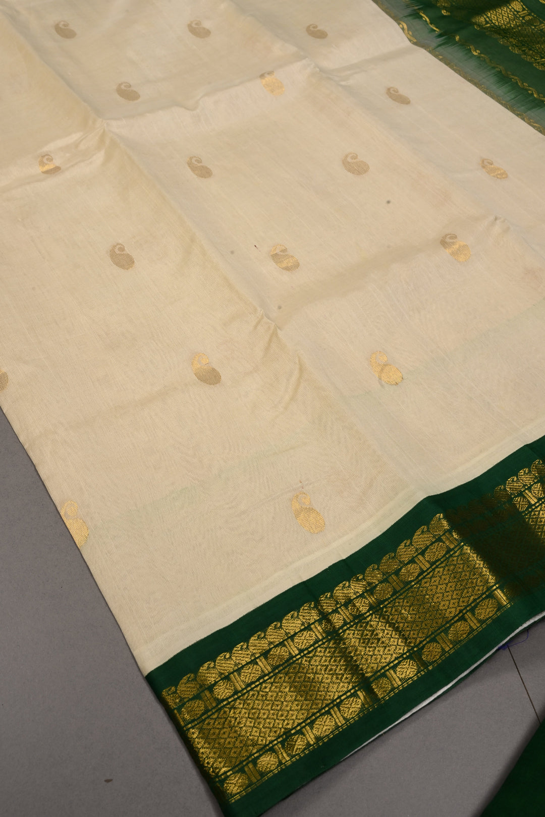 Ivory Kanchi Silk Cotton 100% Handloom Saree with Paisley Zari Buttas and Contrast Zari Border | SHOBITAM