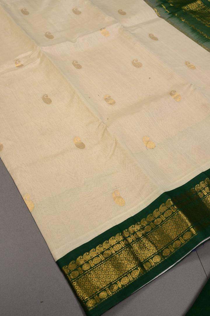 Ivory Kanchi Silk Cotton 100% Handloom Saree with Paisley Zari Buttas and Contrast Zari Border | SHOBITAM