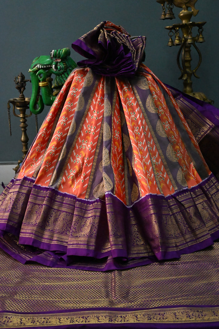 Orange-Purple Ikkat Kanjivaram Fusion Pure Silk Saree with Buttas Panel -Brocade and Zari Border | SILK MARK CERTIFIED | SHOBITAM