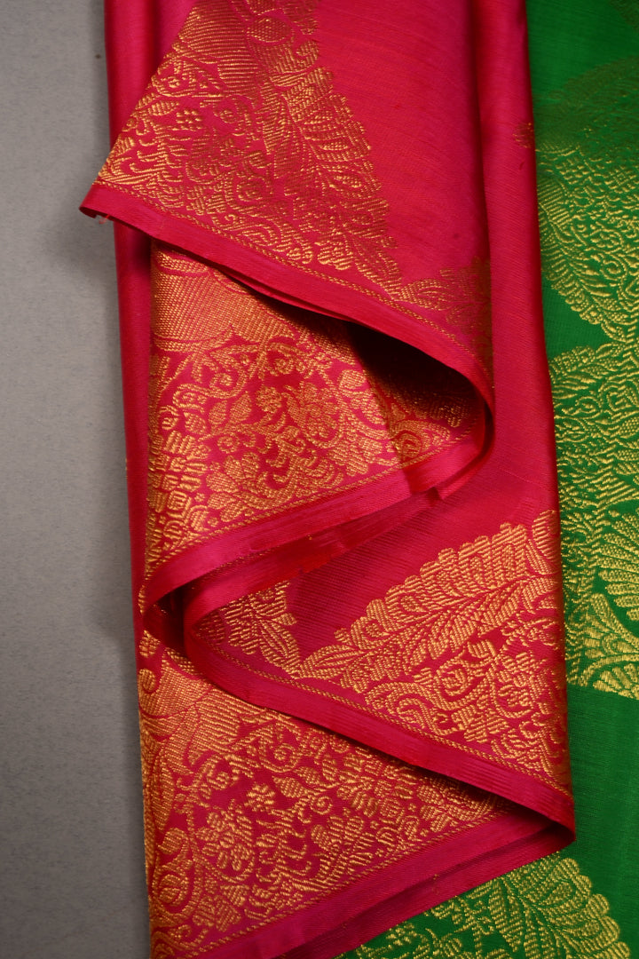 Rani Pink Dual Tone Pure Kanjivaram Silk Saree in Zari Buttas with Twin Peacock Zari Border | SILK MARK CERTIFIED | SHOBITAM