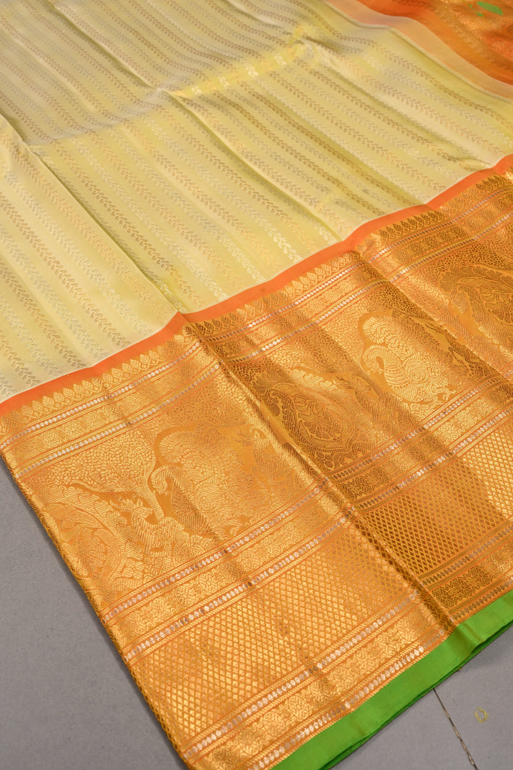 Tea Green Dual Tone Pure Gadwal Silk Saree with Ornate Zari Stripes and Contrast Wide Zari Border | SILK MARK CERTIFIED | SHOBITAM