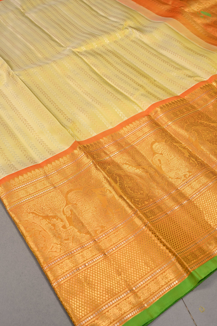 Tea Green Dual Tone Pure Gadwal Silk Saree with Ornate Zari Stripes and Contrast Wide Zari Border | SILK MARK CERTIFIED | SHOBITAM