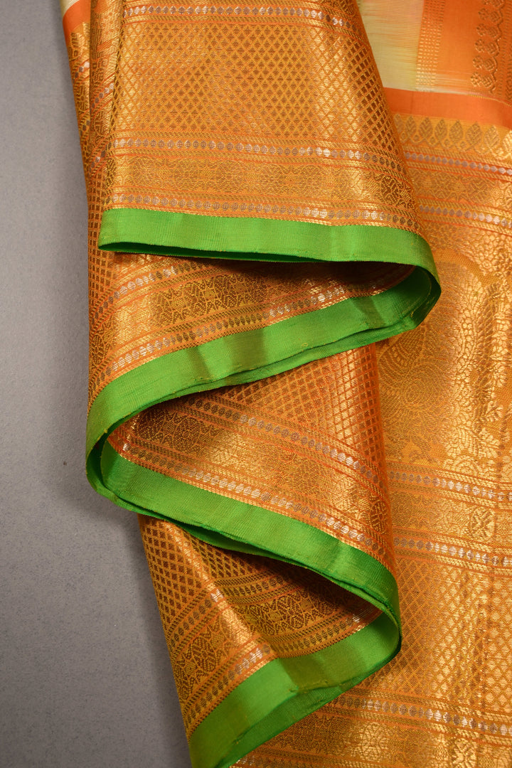 Tea Green Dual Tone Pure Gadwal Silk Saree with Ornate Zari Stripes and Contrast Wide Zari Border | SILK MARK CERTIFIED | SHOBITAM