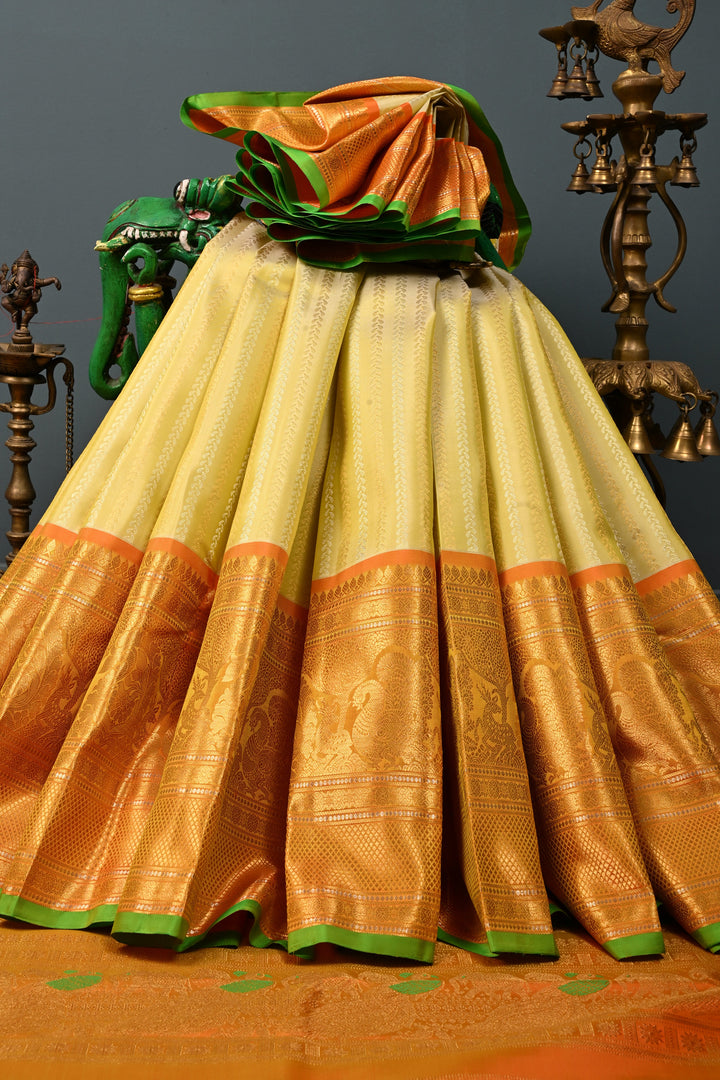 Tea Green Dual Tone Pure Gadwal Silk Saree with Ornate Zari Stripes and Contrast Wide Zari Border | SILK MARK CERTIFIED | SHOBITAM