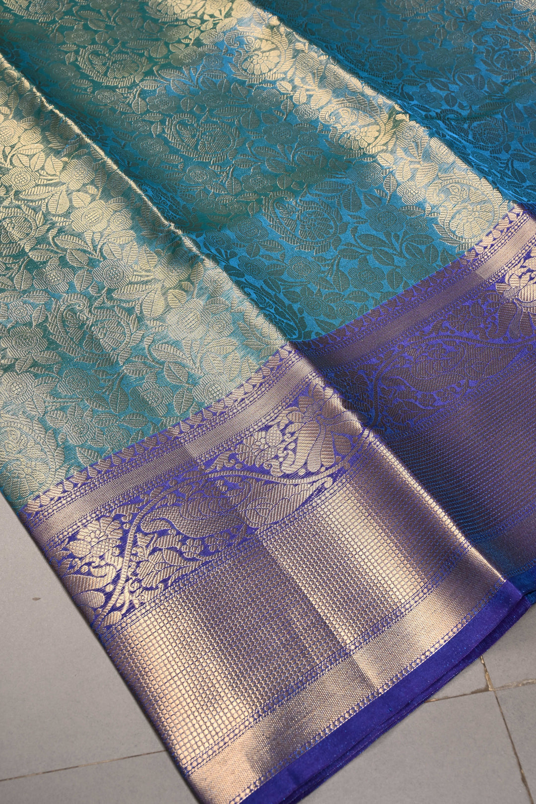 Blue-Green Dual Tone Tissue Kanjivaram Soft Semi Silk Saree with Floral Brocade Jaal and Contrast Wide Zari Border | SHOBITAM