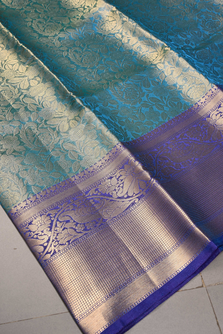 Blue-Green Dual Tone Tissue Kanjivaram Soft Semi Silk Saree with Floral Brocade Jaal and Contrast Wide Zari Border | SHOBITAM