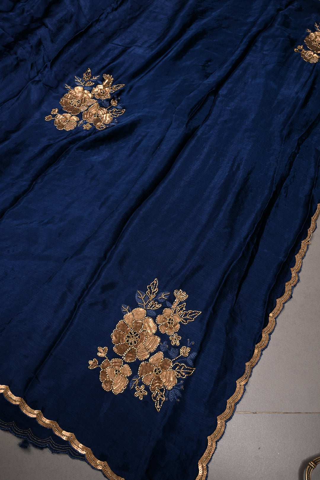 Sapphire Blue Satin Georgette Saree with Antique Matte Finish Cutdana, Sequins and Moti Embellishment and Scallop Border | SHOBITAM