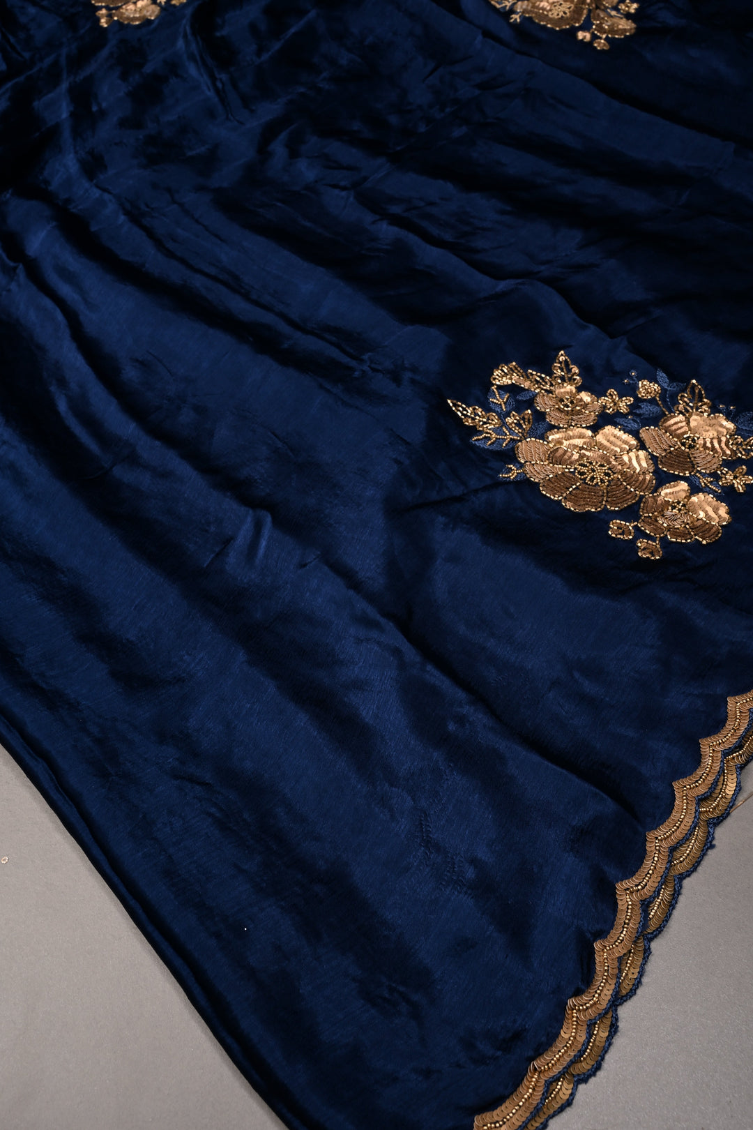 Sapphire Blue Satin Georgette Saree with Antique Matte Finish Cutdana, Sequins and Moti Embellishment and Scallop Border | SHOBITAM
