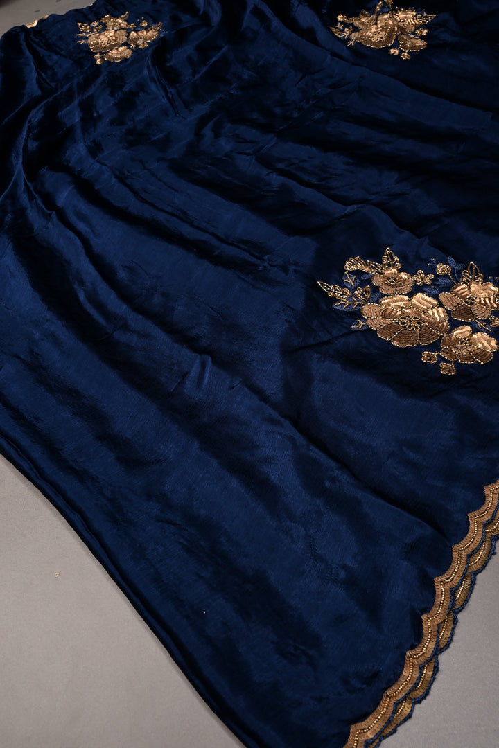 Sapphire Blue Satin Georgette Saree with Antique Matte Finish Cutdana, Sequins and Moti Embellishment and Scallop Border | SHOBITAM