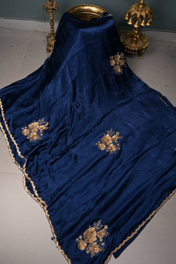 Sapphire Blue Satin Georgette Saree with Antique Matte Finish Cutdana, Sequins and Moti Embellishment and Scallop Border | SHOBITAM