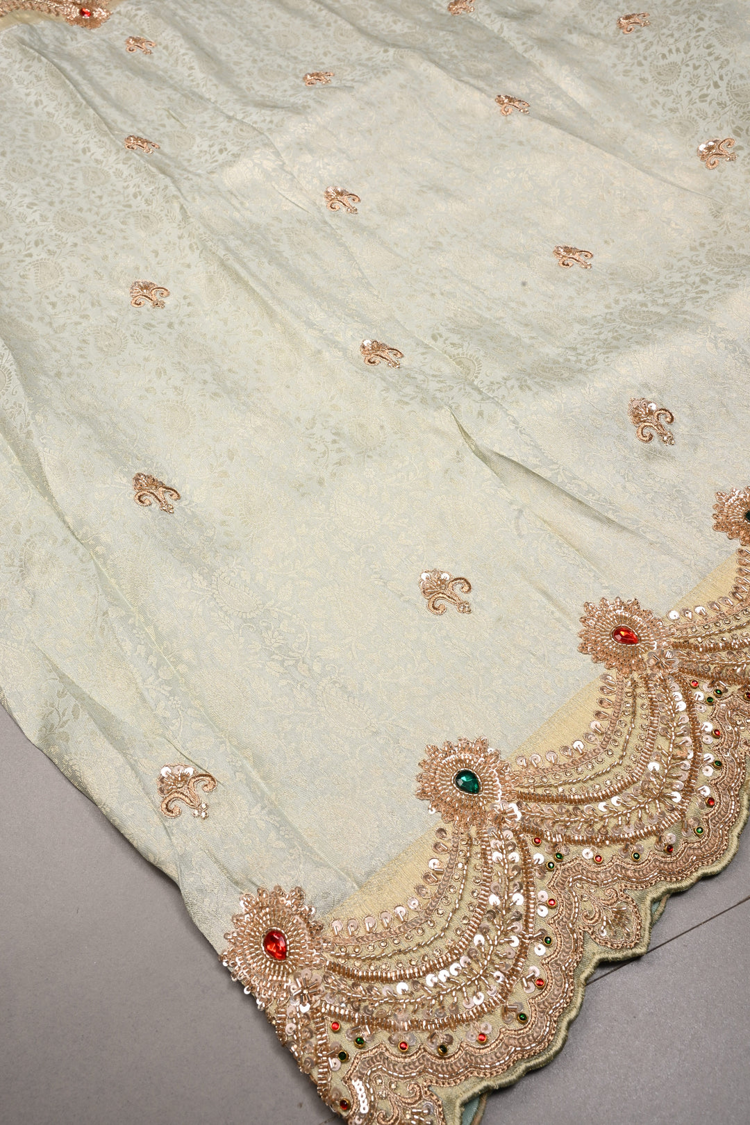 Exquisite Dusty Sage Green Tissue Viscose Brocade Saree with Zardosi Buttas and Heavy Embroidery Work on Scallop Border | SHOBITAM