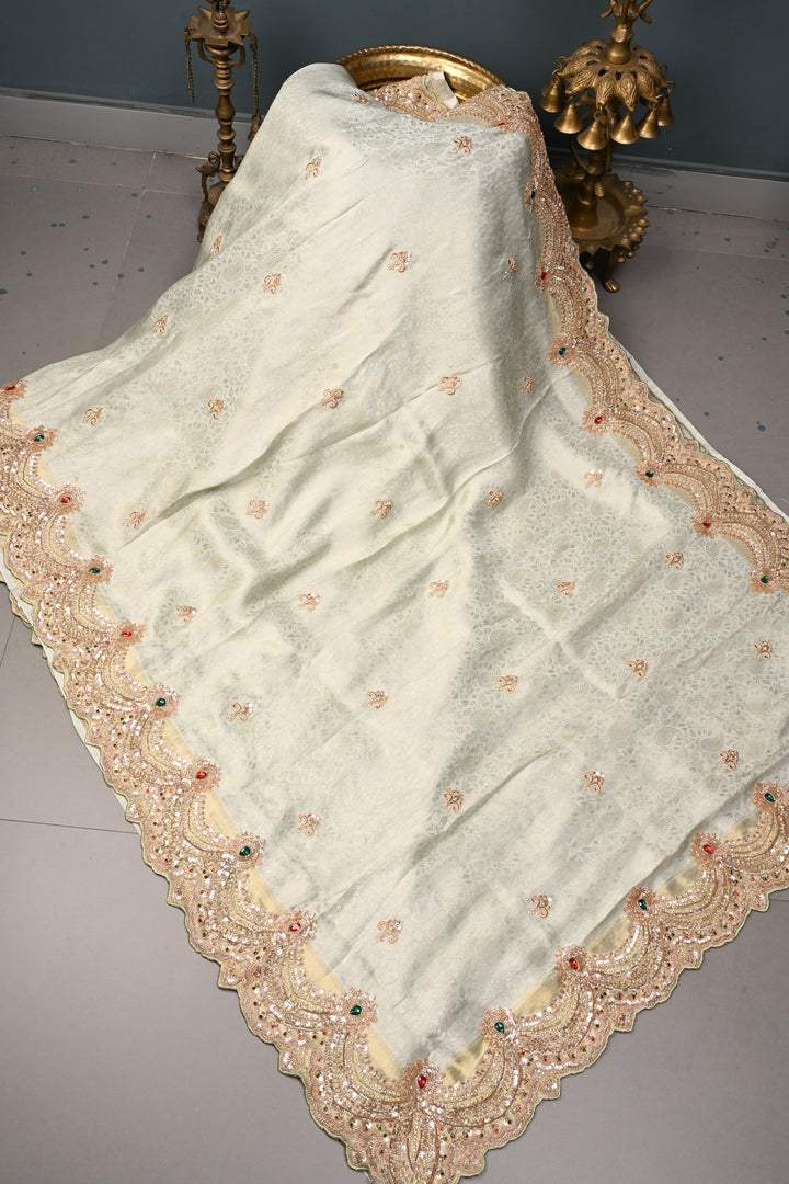 Exquisite Dusty Sage Green Tissue Viscose Brocade Saree with Zardosi Buttas and Heavy Embroidery Work on Scallop Border | SHOBITAM