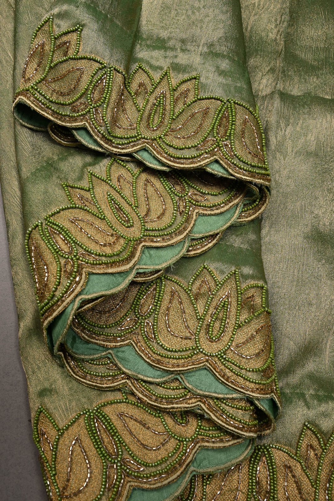 Green Vegan Viscose Tissue Silk Saree with Cutdana and Green Beads Lotus Embroidery Scallop Border | SHOBITAM