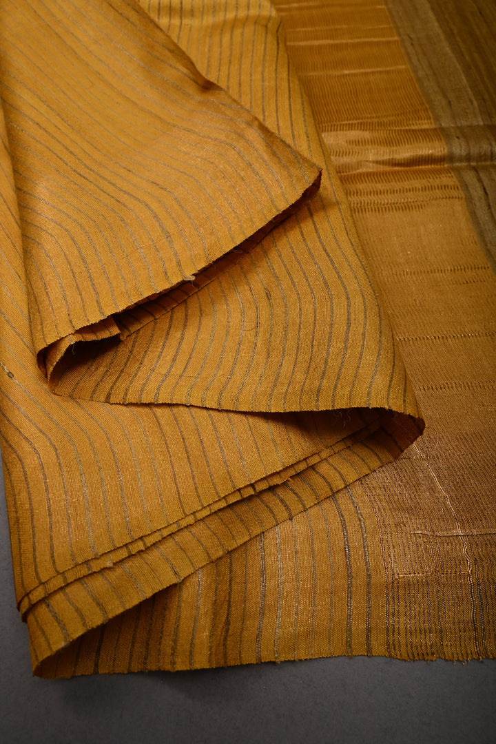 Mustard Yellow Borderless Handloom Tussar Saree with Stripes Pattern  | SILK MARK CERTIFIED | SHOBITAM