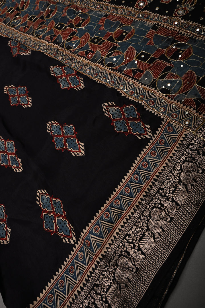 Black Sequins, Cutdana and Mirror Hand Embroidery on Ajrakh Hand Block Print on Dola Silk Saree with Fancy Zari Border | SHOBITAM