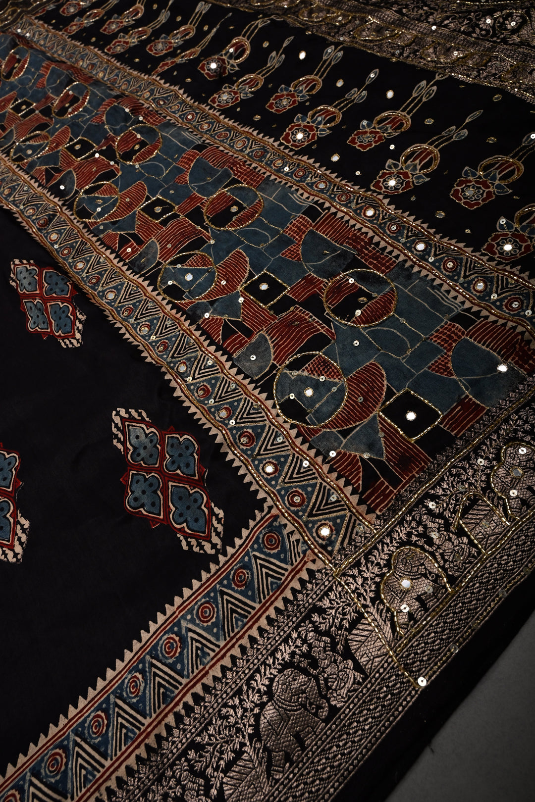 Black Sequins, Cutdana and Mirror Hand Embroidery on Ajrakh Hand Block Print on Dola Silk Saree with Fancy Zari Border | SHOBITAM
