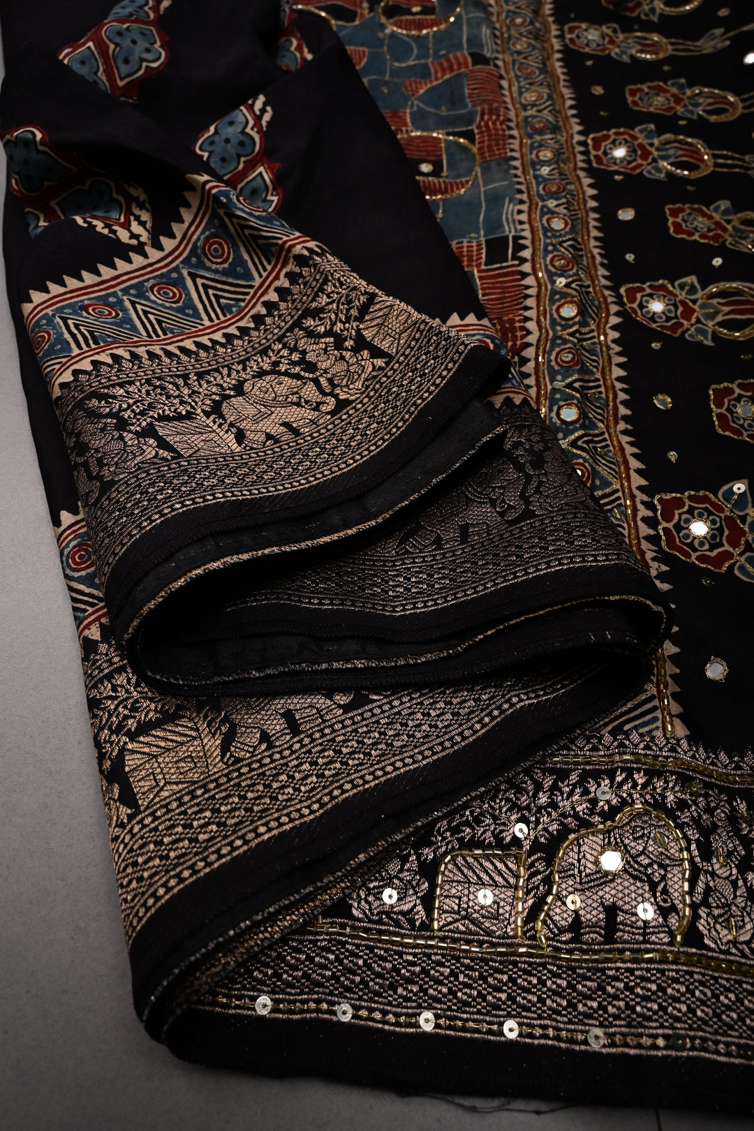 Black Sequins, Cutdana and Mirror Hand Embroidery on Ajrakh Hand Block Print on Dola Silk Saree with Fancy Zari Border | SHOBITAM