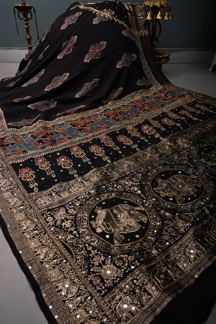 Black Sequins, Cutdana and Mirror Hand Embroidery on Ajrakh Hand Block Print on Dola Silk Saree with Fancy Zari Border | SHOBITAM