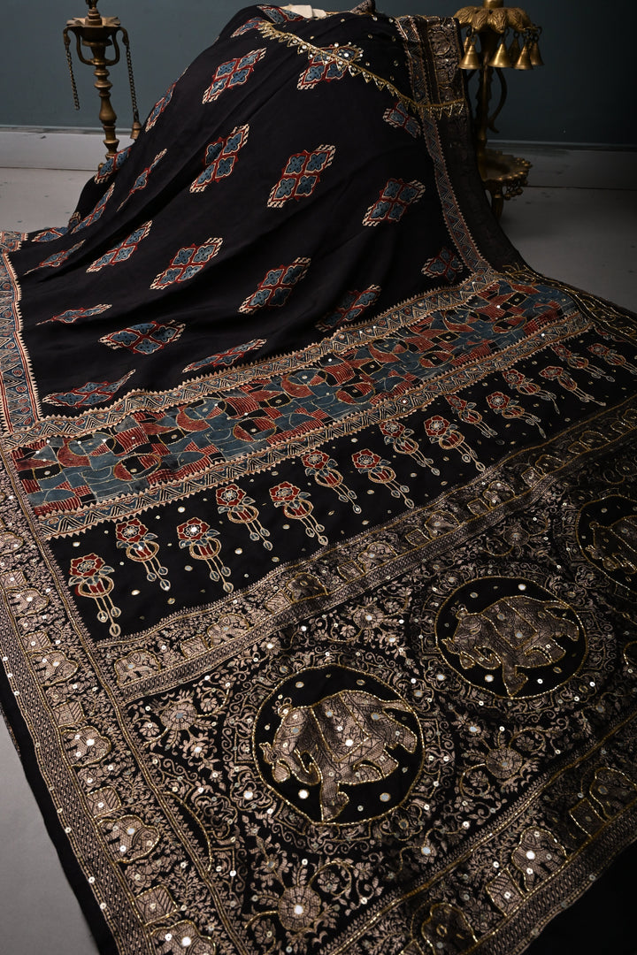 Black Sequins, Cutdana and Mirror Hand Embroidery on Ajrakh Hand Block Print on Dola Silk Saree with Fancy Zari Border | SHOBITAM