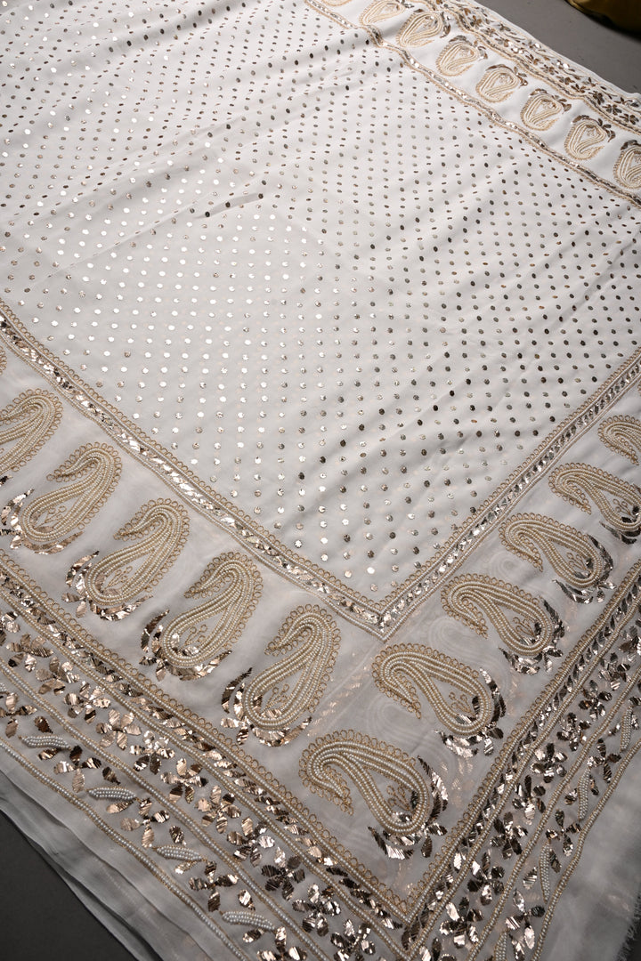 Exquisite Celebrity Mukeish and Moti Handwork Embellished on Pure Georgette Saree in White with Paisley Border | SHOBITAM