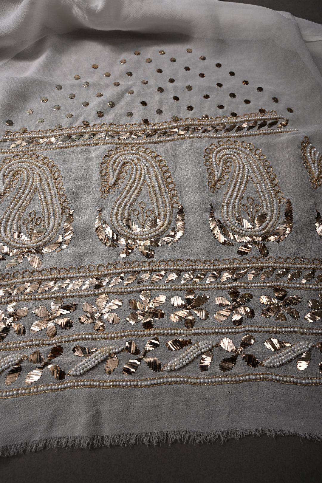 Exquisite Celebrity Mukeish and Moti Handwork Embellished on Pure Georgette Saree in White with Paisley Border | SHOBITAM