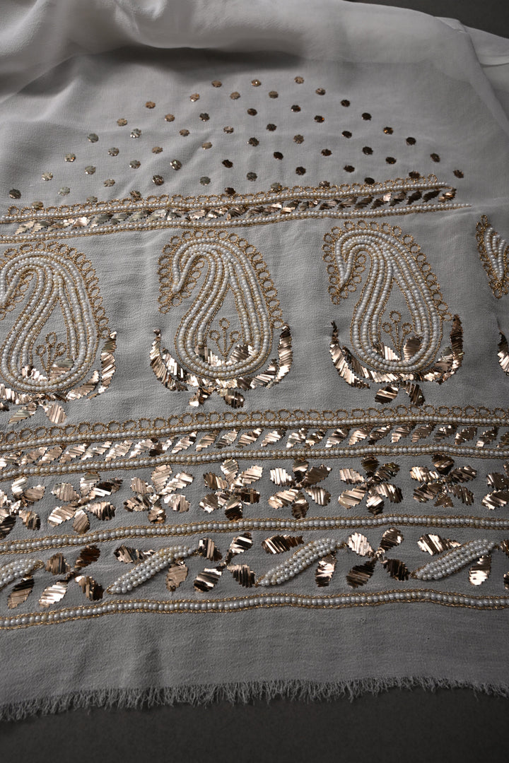 Exquisite Celebrity Mukeish and Moti Handwork Embellished on Pure Georgette Saree in White with Paisley Border | SHOBITAM