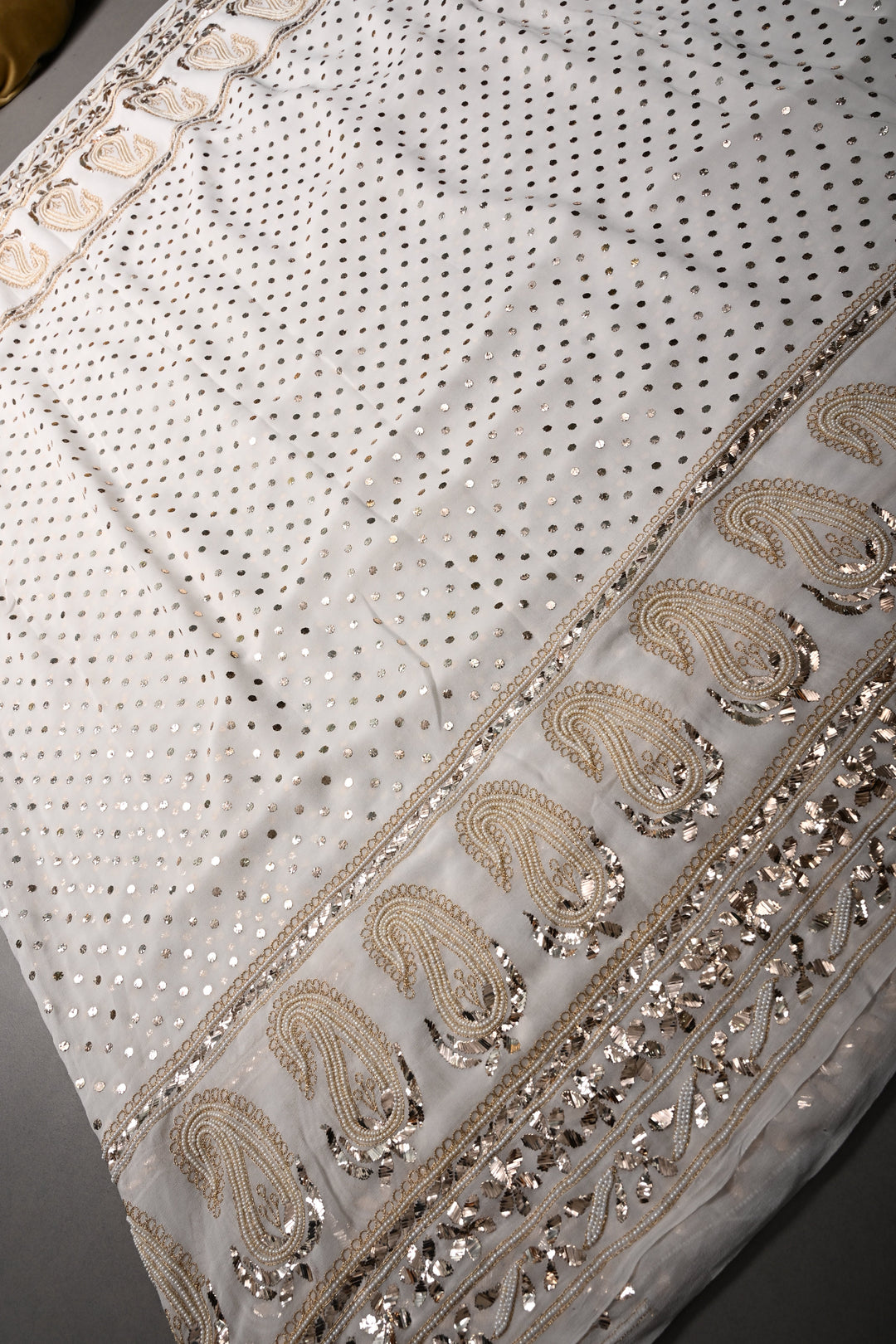 Exquisite Celebrity Mukeish and Moti Handwork Embellished on Pure Georgette Saree in White with Paisley Border | SHOBITAM