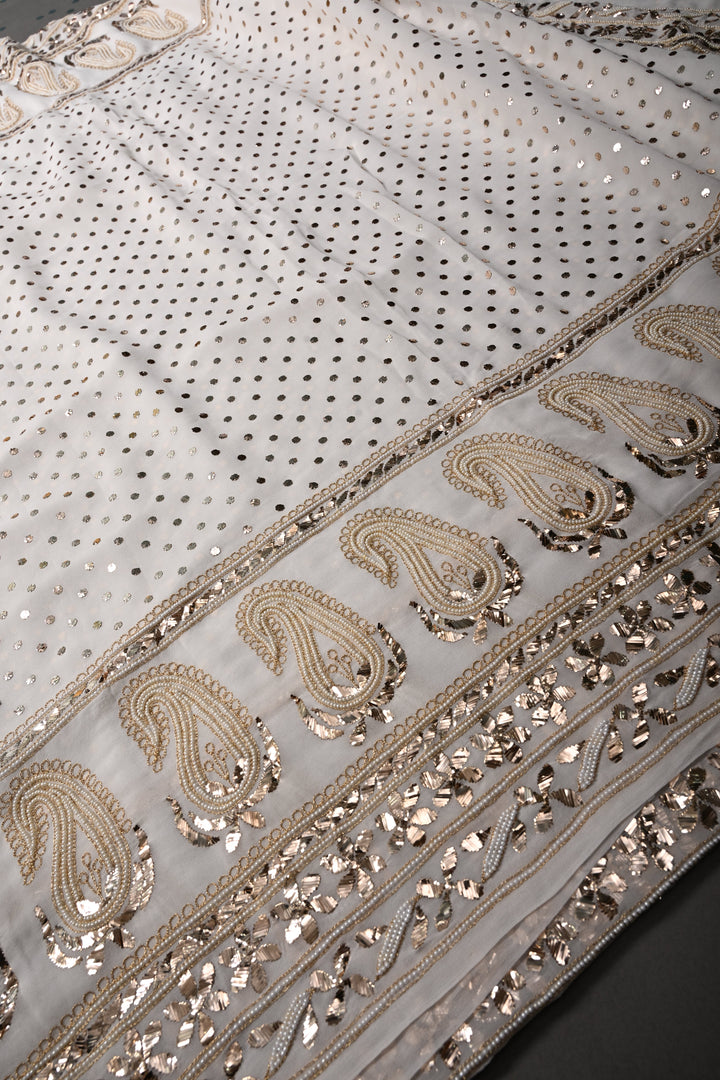 Exquisite Celebrity Mukeish and Moti Handwork Embellished on Pure Georgette Saree in White with Paisley Border | SHOBITAM