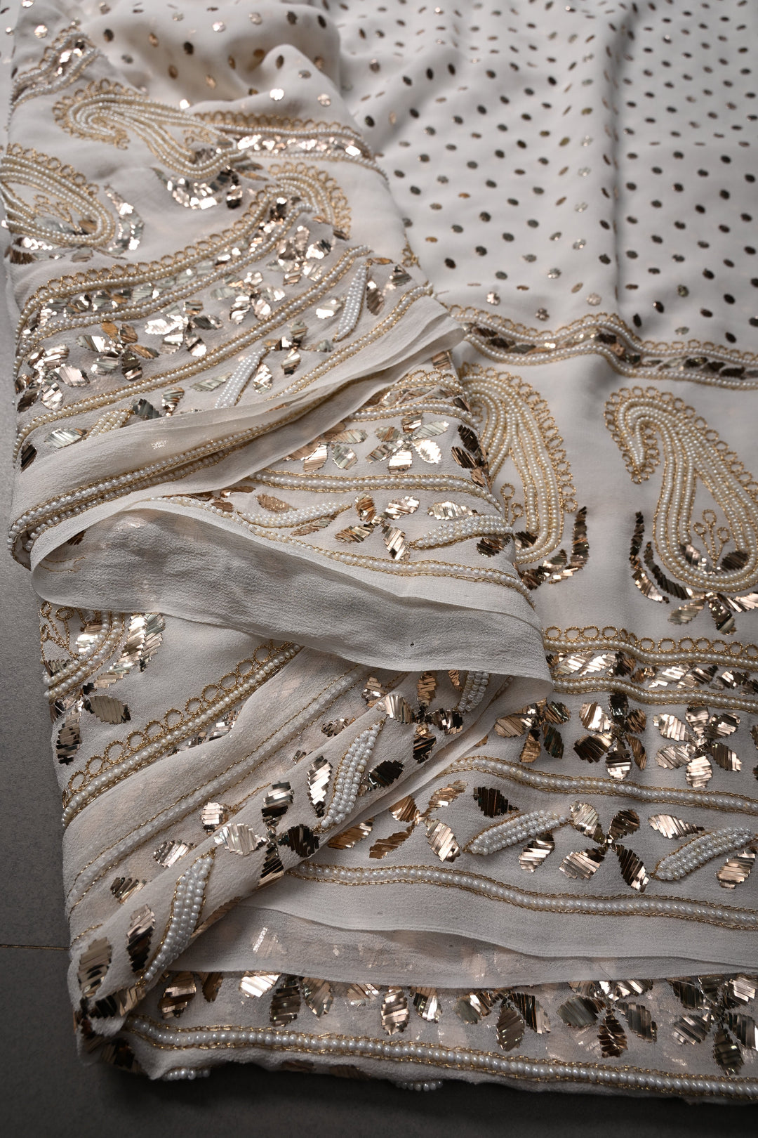Exquisite Celebrity Mukeish and Moti Handwork Embellished on Pure Georgette Saree in White with Paisley Border | SHOBITAM