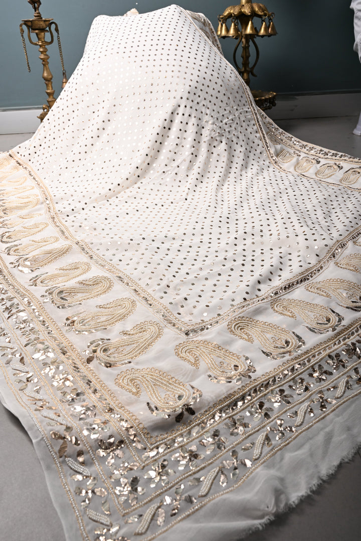Exquisite Celebrity Mukeish and Moti Handwork Embellished on Pure Georgette Saree in White with Paisley Border | SHOBITAM