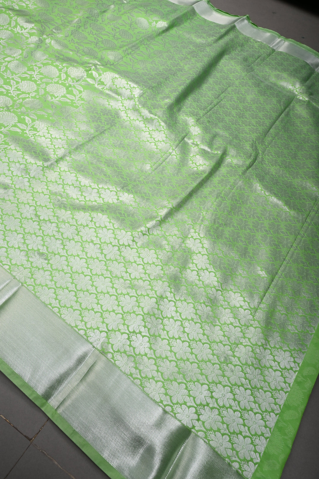 Neon Green Kanjivaram Soft Semi Silk Saree with Silver Floral Brocade Jaal and Zari Border | SHOBITAM