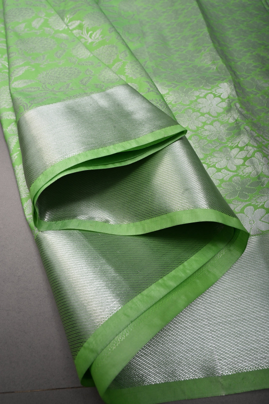 Neon Green Kanjivaram Soft Semi Silk Saree with Silver Floral Brocade Jaal and Zari Border | SHOBITAM